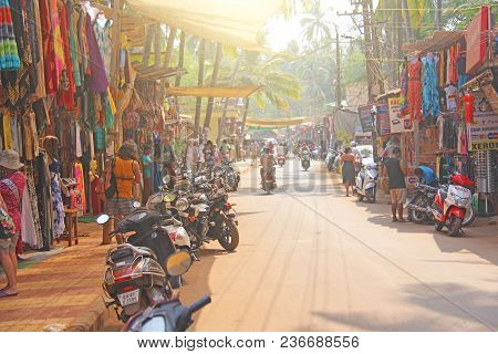 India, Goa, Arambol. January 28, 2018. The Central Street Of Arambol, On Which People Go On Scooters