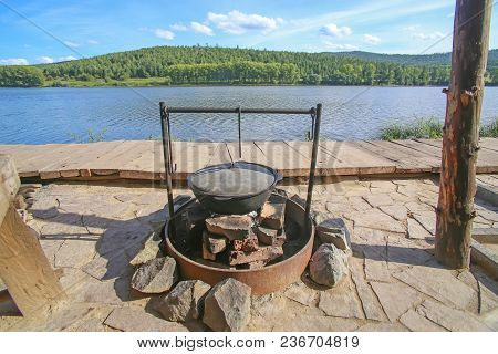 Cauldron A Bonfire For Cooking On The River Coast