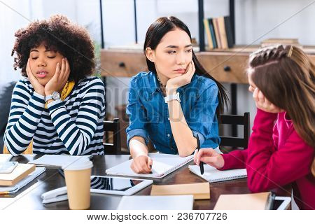 Tview Of Ired Multiracial Students Doing Homework Together