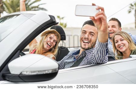 Happy Friends Making A Selfie Video Streaming In Convertible Car On Summer Vacation - Young People H