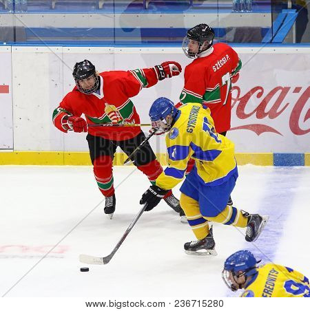 Kyiv, Ukraine - April 17, 2018: Forward Olexi Syrotenko Of Ukraine (in Yellow) Attacks During The Ii