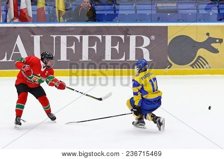 Kyiv, Ukraine - April 17, 2018: Patrik Balazs Szecsi Of Hungary (l) Fights For A Puck With Olexander