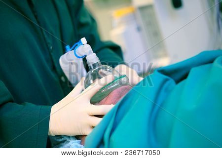 Doctor Presses The Artificial Respiratory Mask To The Patient's Face, Cconcept Of An Anesthesiologis