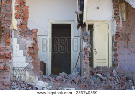 View Of A Dilapidated House. The Destroyed Walls In The Process Of Demolishing The Dilapidated House