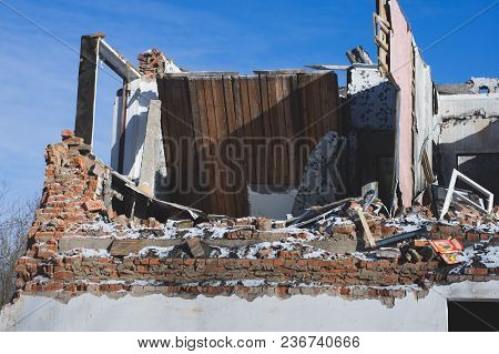 View Of A Dilapidated House. The Destroyed Walls In The Process Of Demolishing The Dilapidated House