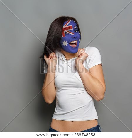 Portrait Of Happy Woman With The Flag Of Australia Painted On His Face. Football Or Soccer Team Fan,