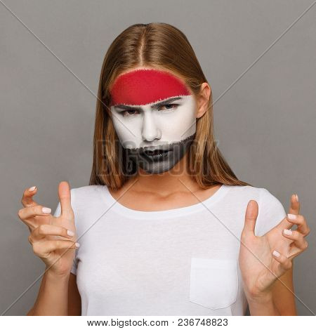 Face Of Young Sad Woman Painted With Flag Of Egypt. Football Or Soccer Team Fan, Sport Event, Facear