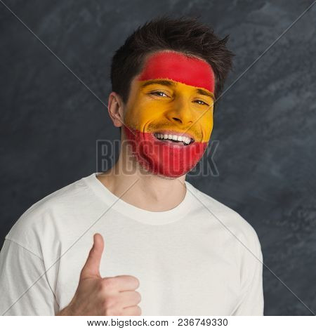 Face Of Young Happy Man Painted With Flag Of Spain. Football Or Soccer Team Fan, Sport Event, Facear