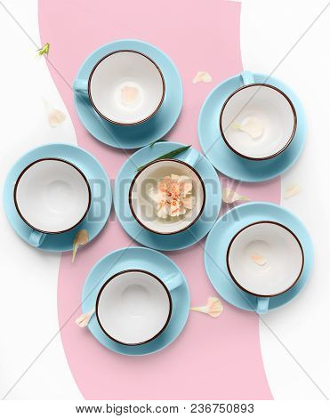 Clean Coffee Or Tea Set. Plenty Of Elegant Porcelain Light Blue Cups And Saucers At Funky Abstract P