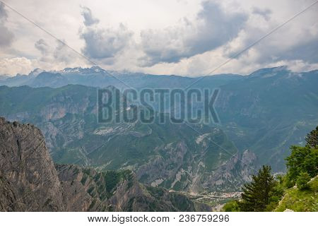 The Tops Of The Picturesque Mountains Are Covered With White Snow.