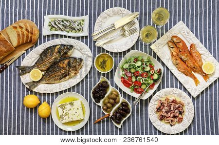 Freshly Cooked Seafood Grilled Sea Bream Fishes, Fried Red Mullets, Octopus In Vinegar Sauce, Sardin