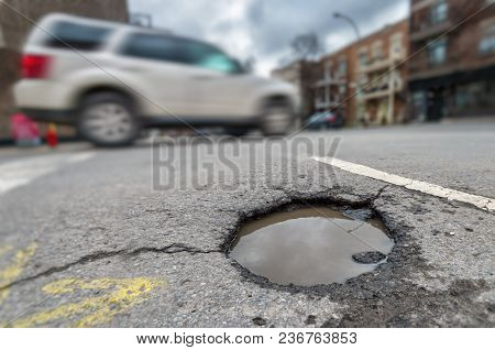 Large Unrepaired Pothole On Laurier Street In Montreal, Canada (2018)