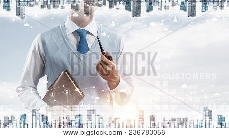 Double Exposure Of Confident And Young Businessman In Smart-casual Wear Smoking Pipe And Modern City