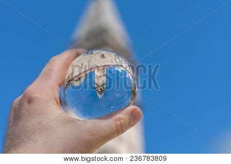 Saint Nikola Church Tower Reflected In A Glass Ball Held By A Tourist, Perast, Kotor Harbor, Montene