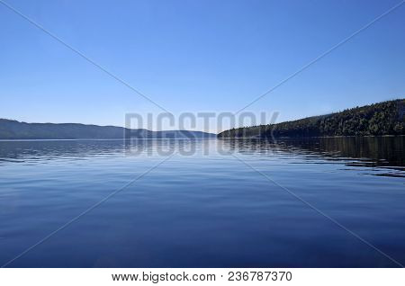 Amazing Blue Sky Over The Surface Of The Wide River