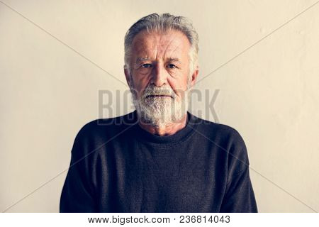 Protrait of elderly caucasian man with thoughtful face expression