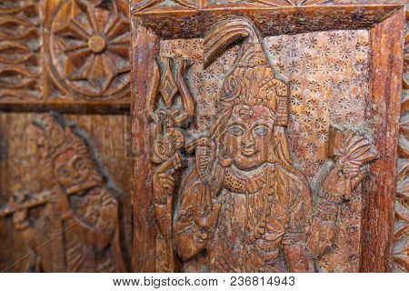 Vashisht, India - May 27, 2017: Traditional wooden carving on the hindu temple in Vashisht village in Kullu valley, Himachal Pradesh, India