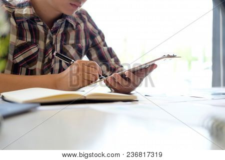 Audit Man Checklist Of Financial In Chart Board On Table Modern Office.