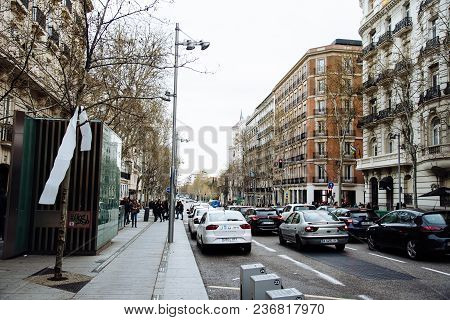 Madrid, Spain - April 7, 2018:  Serrano Street In Salamanca District A Cloudy Day. Salamanca Is Well