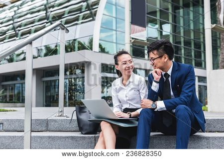 Asian business people working together in a city