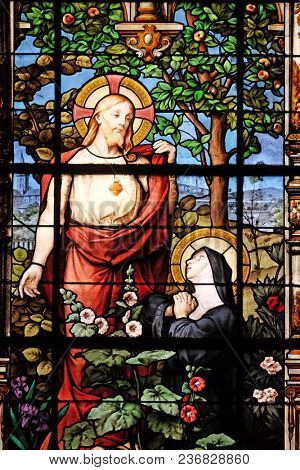 PARIS, FRANCE - JANUARY 11: Apparition of the Sacred Heart to Marguerite Marie Alacoque, stained glass windows in the Saint Gervais and Saint Protais Church, Paris, France on January 11, 2018.