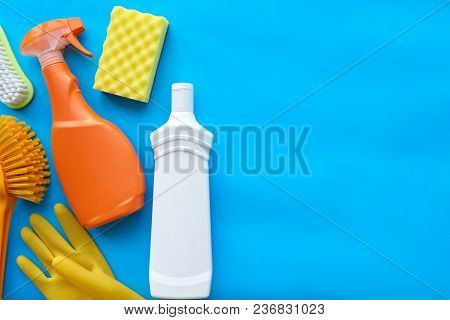 Various House Cleaning Products On Blue Background