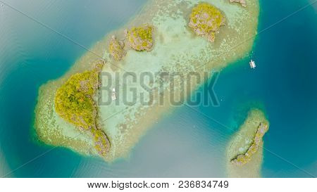 Aerial View Of Small Islands Siete Pecados With Boats In Coron Bay. Palawan