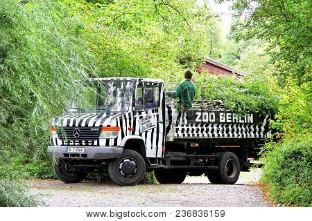 Berlin, Germany - September 11, 2013: Flat-bed Truck Mercedes-benz Vario 814d In The Berlin Zoo.