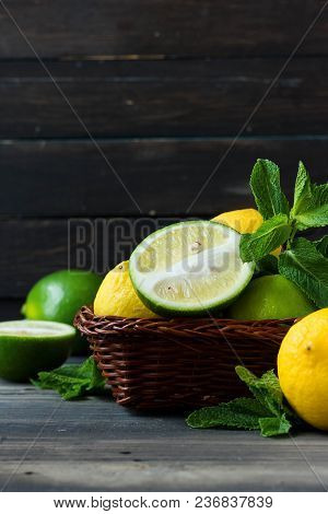 Fresh Citrus And Mint In A Wooden Basket