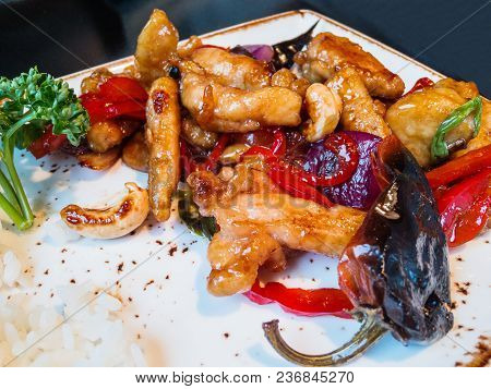 Asian Cuisine - Tori No Casu. Fried Chicken Meat With Cashew Nuts And Pepper In Hot Sauce, Boiled Ri