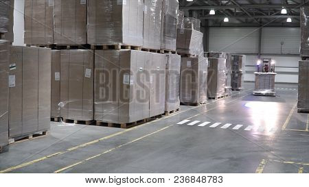 Lift Truck In Factory. Clip. Wholesale Logistic, Loading, Shipment And People Concept - Man With Loa