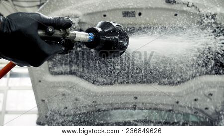 White Car On The Car Wash. Window