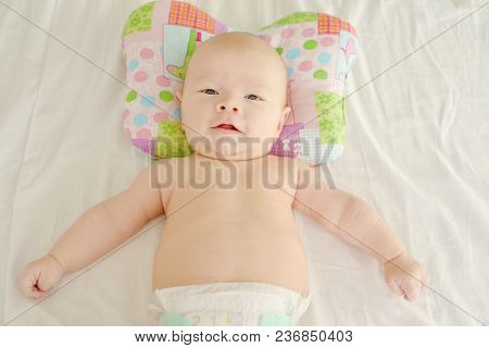 Newborn Baby Boy On The Orthopedic Pillow