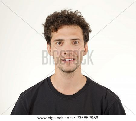 Young Joyful Man In Black T-shirt Smiling