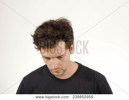Upset Man In Black T-shirt Portrait. Sad Young Man With No Hope