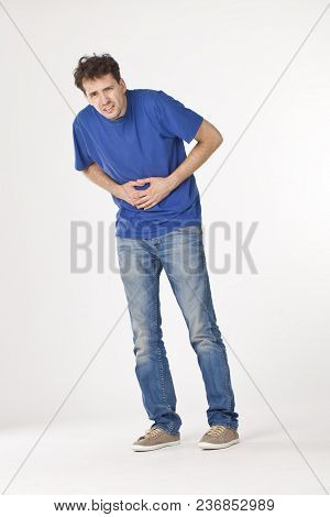 Young Man In Blue Shirt Has Hurt The Stomach
