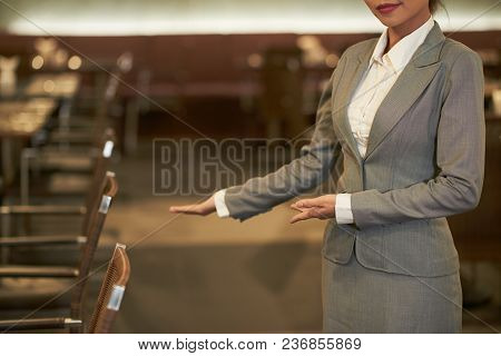 Cropped Image Of Hostess Welcoming Guests Of Restaurant
