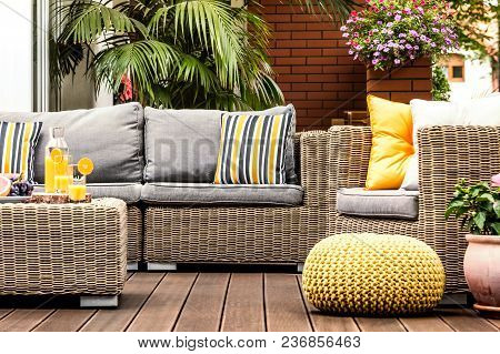 Yellow Pouf On Wooden Terrace