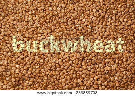 Texture Of Fresh Clean Useful Buckwheat Groats Grain Close-up. Healthy Dietary Food Rich In Microele