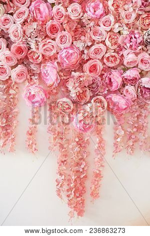 Flower Garland On The Wall. Dense Wall Of Flowers. Wedding Photo Zone. Romantic Space Decor