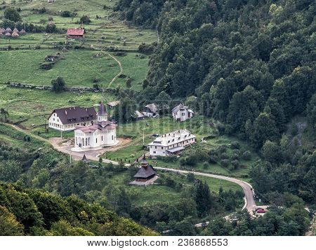 Beautiful Mountain Landscape With A New And An Old Church,dumesti, Salciua, Apuseni, Romania