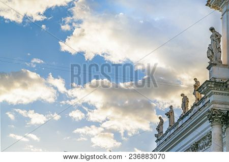Sculptures At Top Of Ancient Building, Rome, Italy