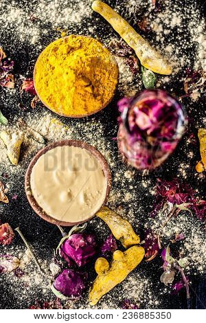 Ayurvedic Ubtan Of Haldi With Holy Rose Water And Fuller’s Earth On Wooden Surface For Good, Brighte