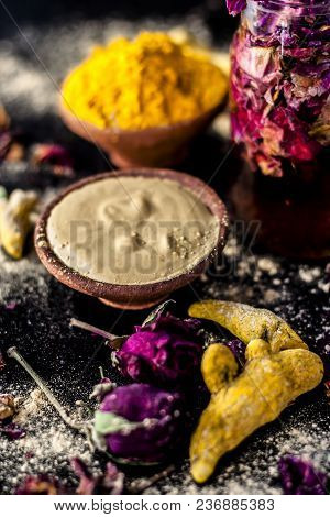 Ayurvedic Ubtan Of Haldi With Holy Rose Water And Fuller’s Earth On Wooden Surface For Good, Brighte