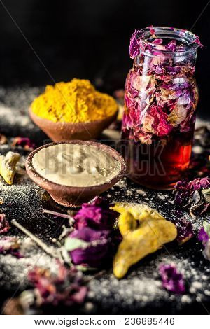 Ayurvedic Ubtan Of Haldi With Holy Rose Water And Fuller’s Earth On Wooden Surface For Good, Brighte