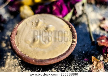 Ayurvedic Ubtan Of Haldi With Holy Rose Water And Fuller’s Earth On Wooden Surface For Good, Brighte