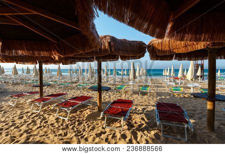 Morning Paradise White Sandy Beach The Maldives Of Salento With Sunshades And Sunbeds (pescoluse, Sa