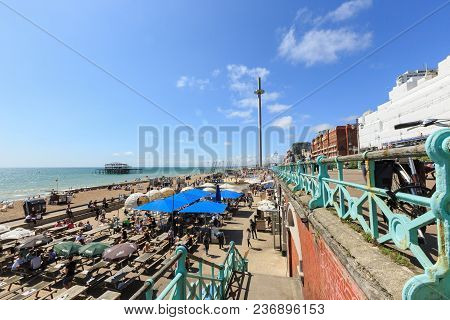 Brighton, United Kingdom - August 1, 2017: Tourists Admire The Amazing View Of English Channel And T