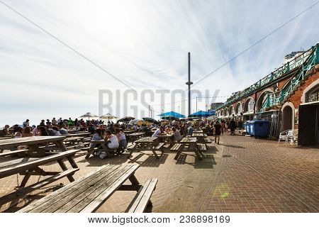Brighton, United Kingdom - August 1, 2017: Tourists Admire The Amazing View Of English Channel And T