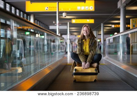 The Girl Is Riding On The Travolator